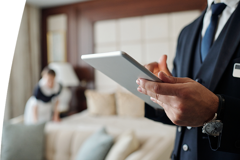 young male manager of hotel using digital tablet